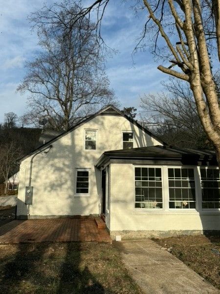 Front facade of a home during exterior painting.