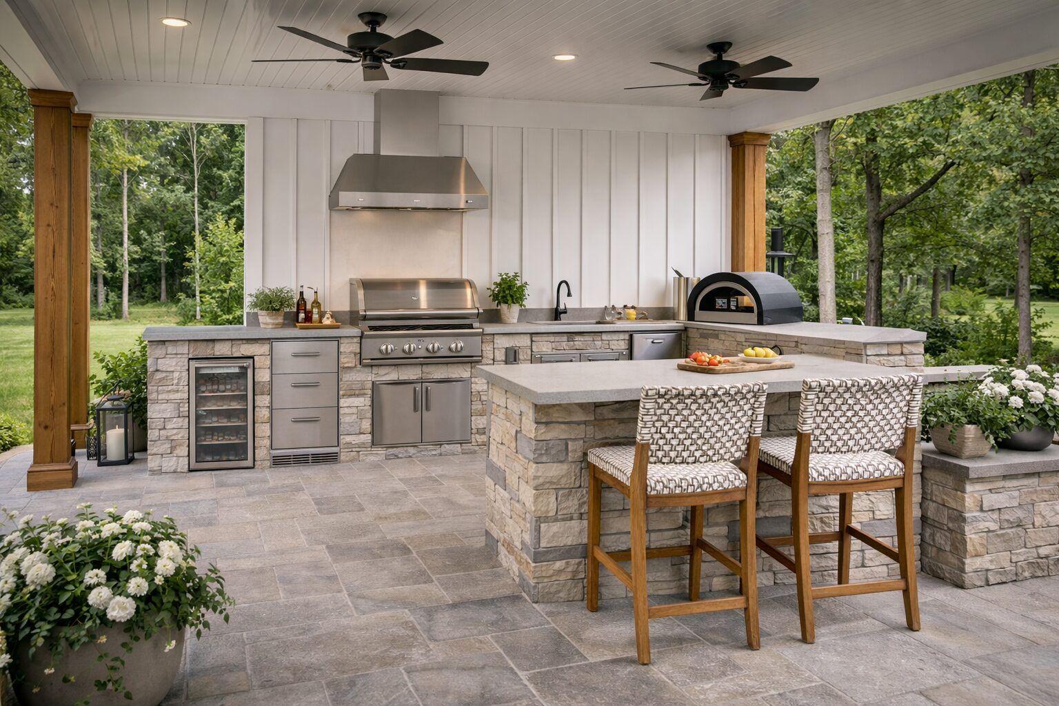 Outdoor kitchen with rustic finishes and a built-in grill.