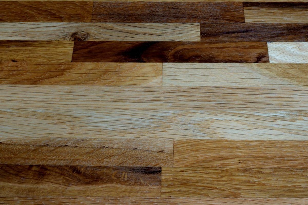 Wood-look plank flooring close-up with aligned seams.