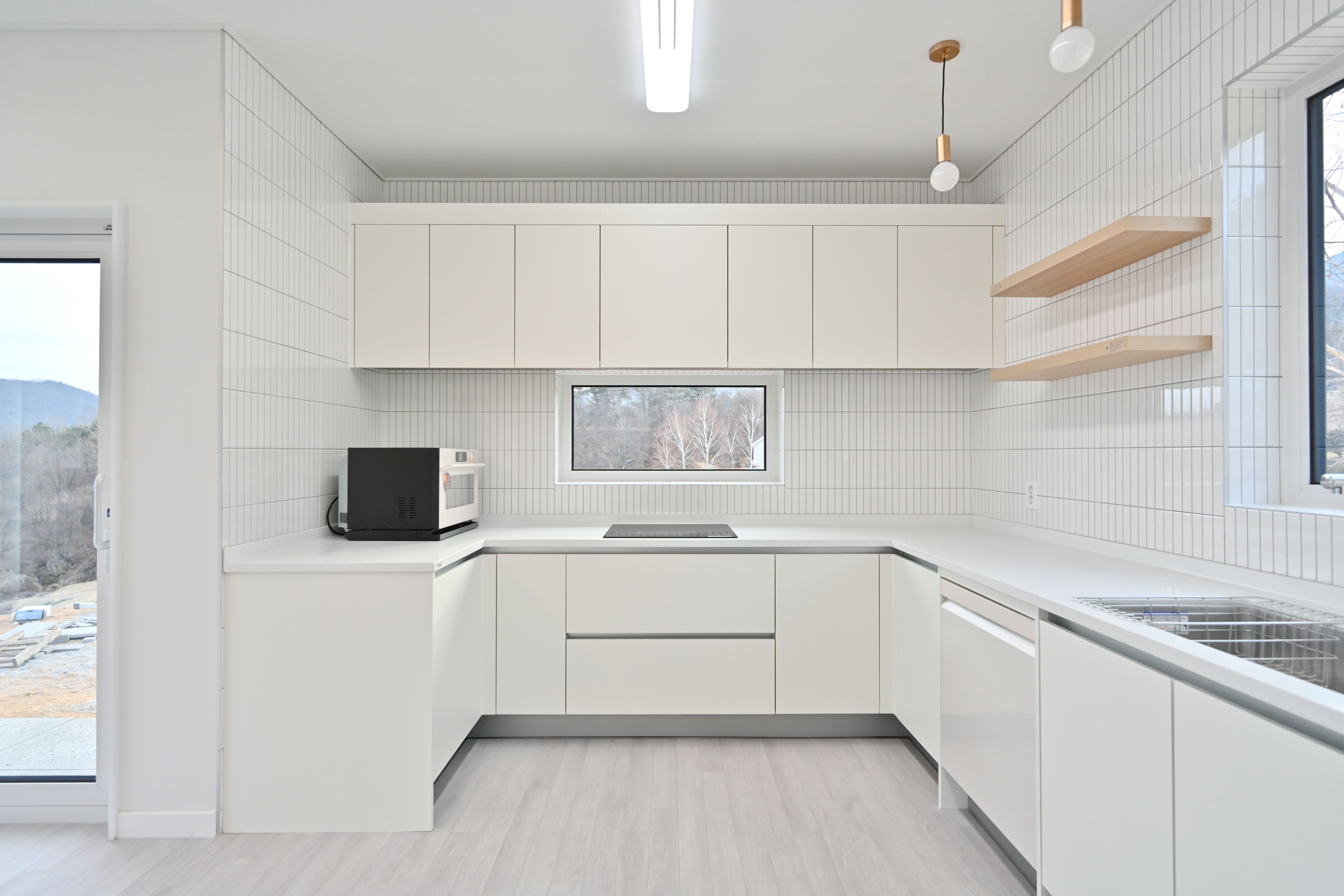 Kitchen with white cabinetry and clean finish lines.